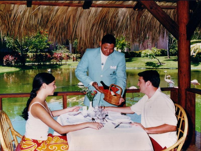 Natura Park Beach & Spa Eco Resort Punta Cana Exterior photo A waiter serves wine at a restaurant
