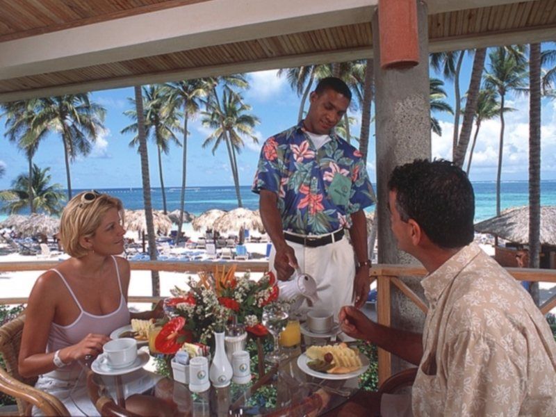 Natura Park Beach & Spa Eco Resort Punta Cana Exterior photo A waiter serving guests at a resort
